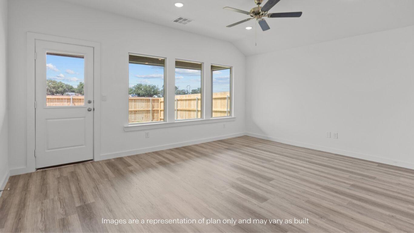 7411 9th Street Lubbock, TX 79416 - Photo 7 of 20 wooden floor in an empty room with a window