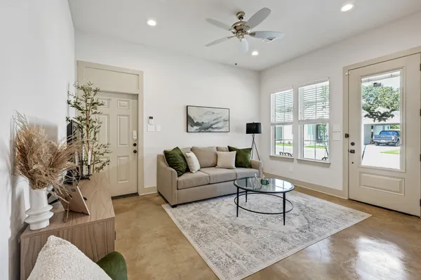 a living room with furniture and a large window