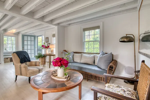 a living room with furniture and a window