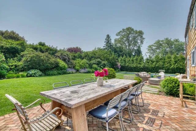 an outdoor space with furniture and garden