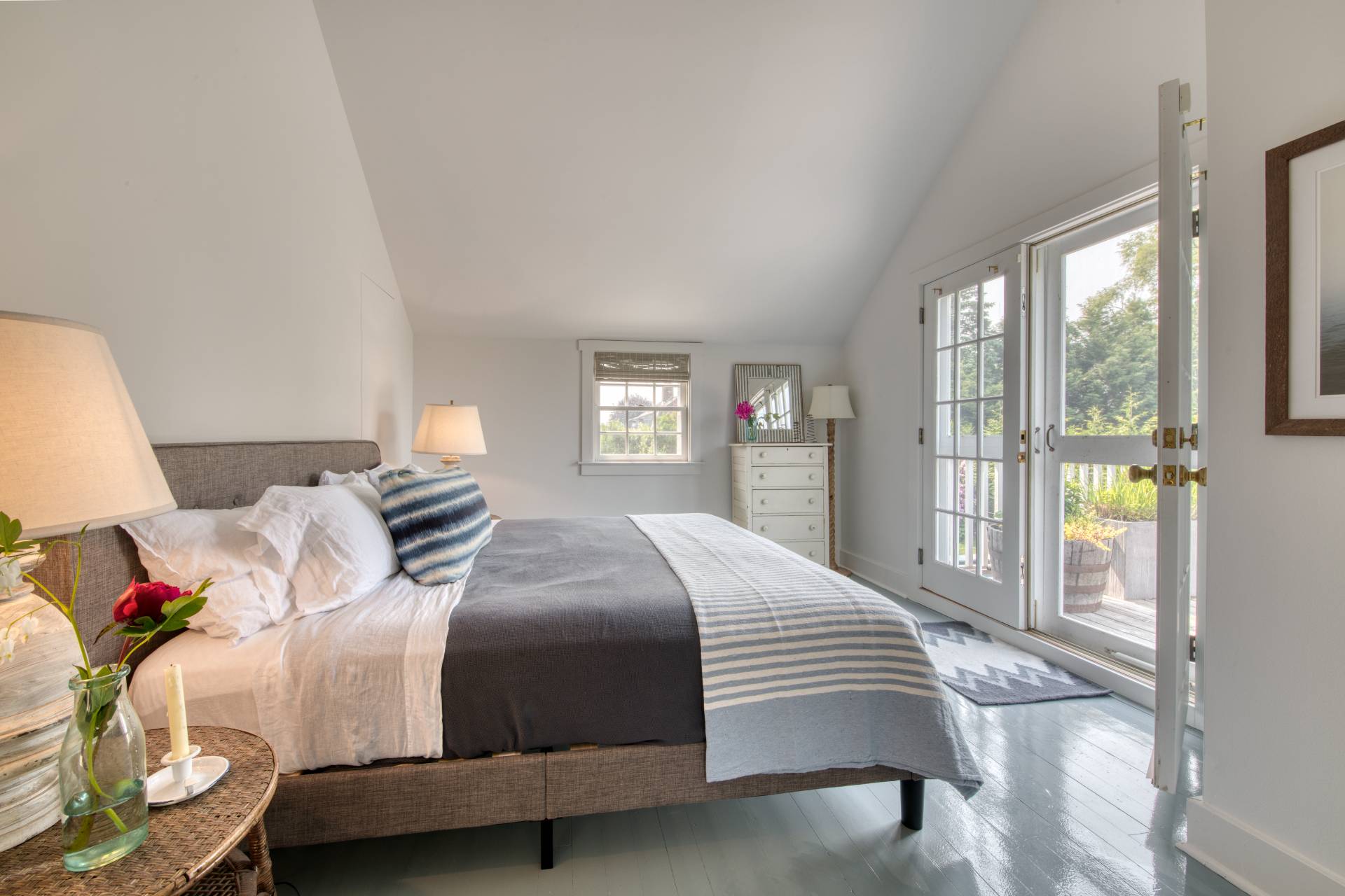 75 Narod Boulevard Water Mill, NY 11976 - Photo 22 of 29 a bedroom with a bed and wooden floor