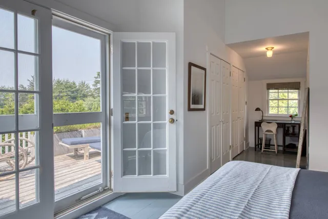 a bedroom with windows