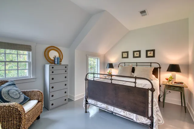 a bedroom with furniture and window