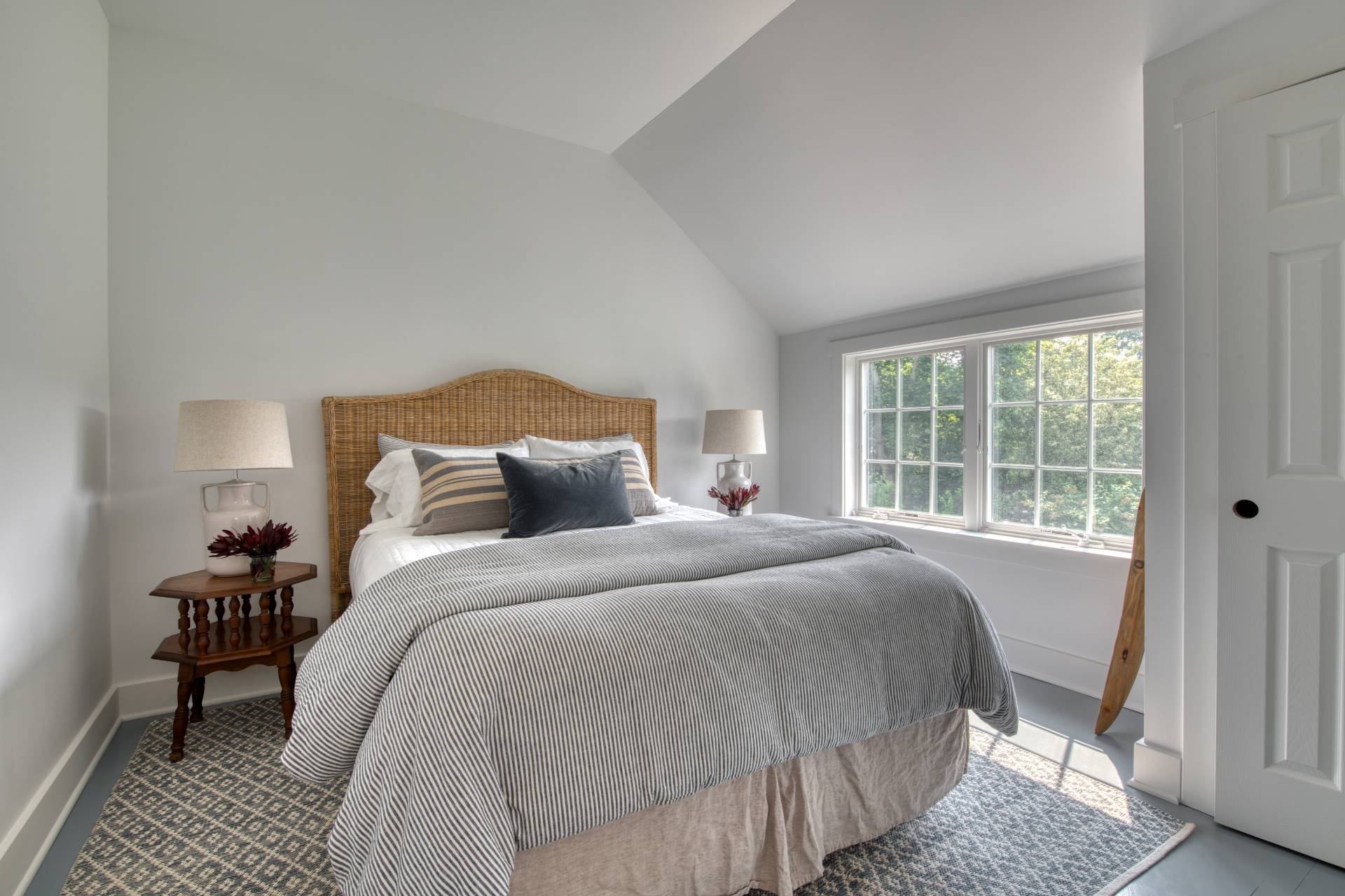 75 Narod Boulevard Water Mill, NY 11976 - Photo 27 of 29 a bedroom with a bed and wooden floor