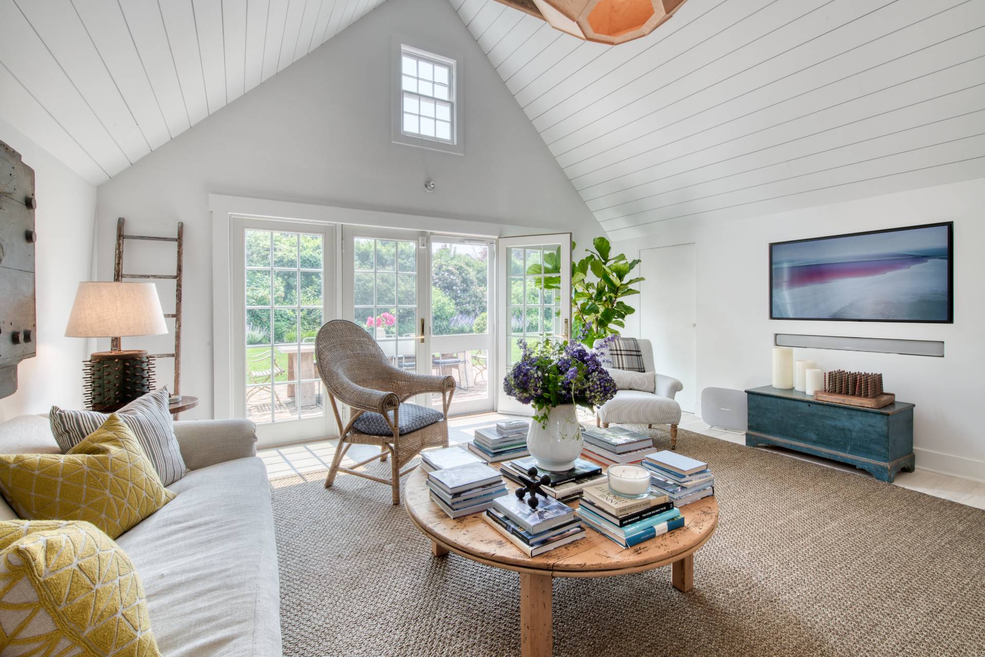 75 Narod Boulevard Water Mill, NY 11976 - Photo 7 of 29 a living room with furniture and a flat screen tv