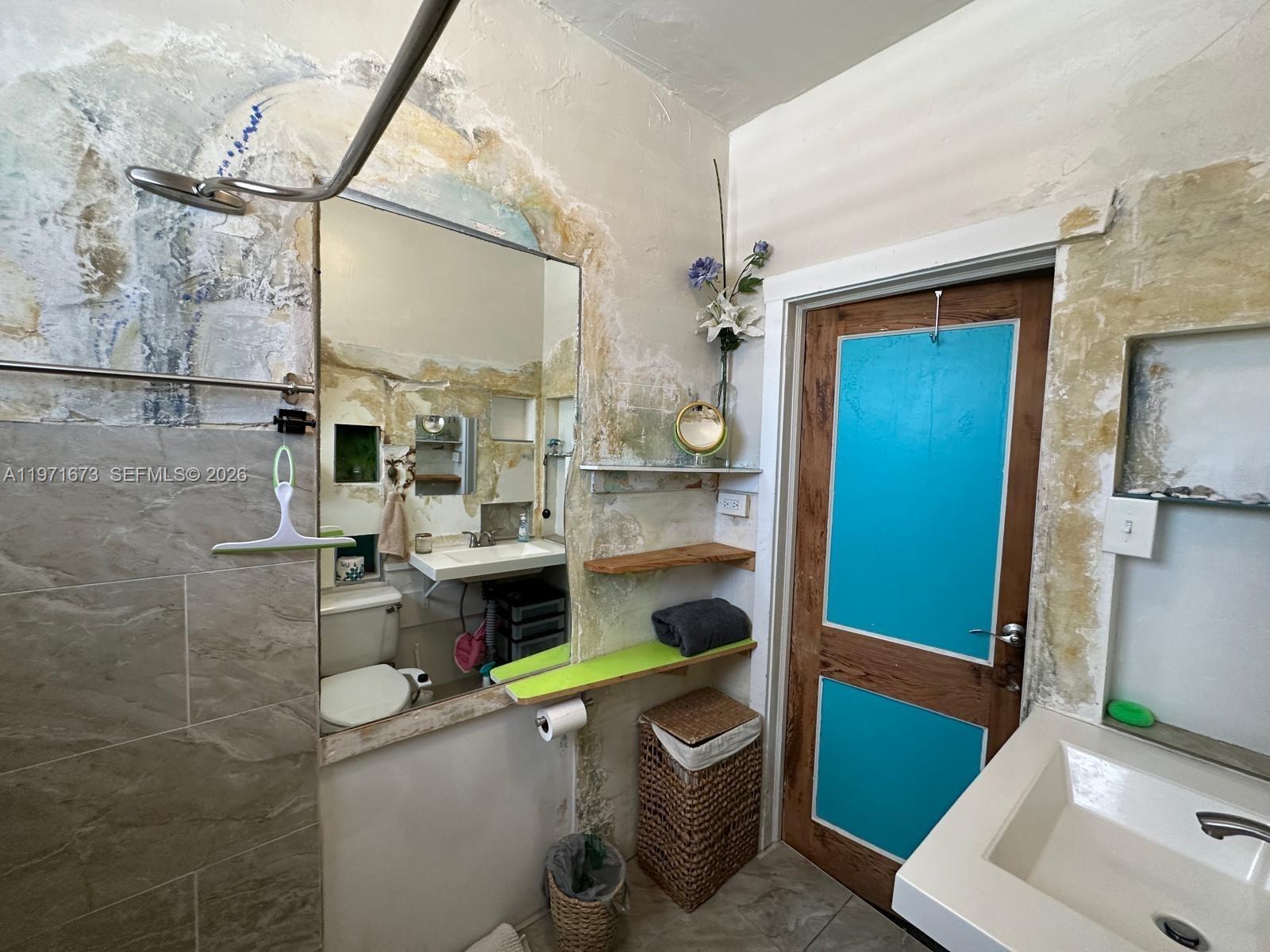 428 Southwest 9th Street, Unit 15 Miami, FL 33130 - Photo 11 of 13 a bathroom with a toilet and a sink