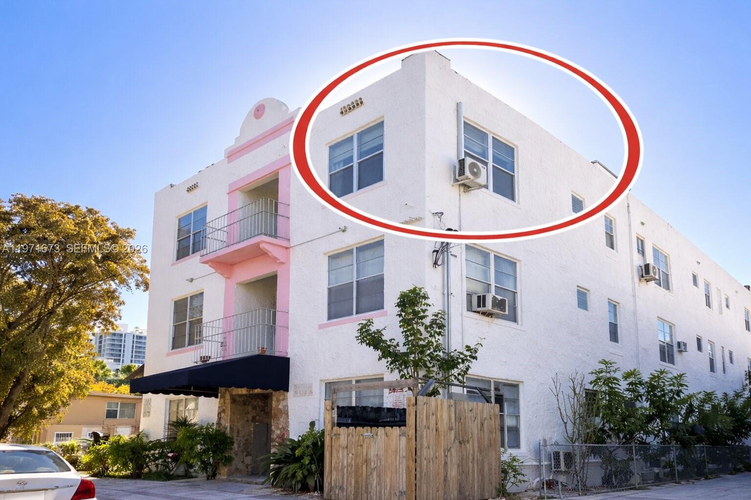 428 Southwest 9th Street, Unit 15 Miami, FL 33130 - Photo 12 of 13 a front view of a multi story residential apartment building with yard