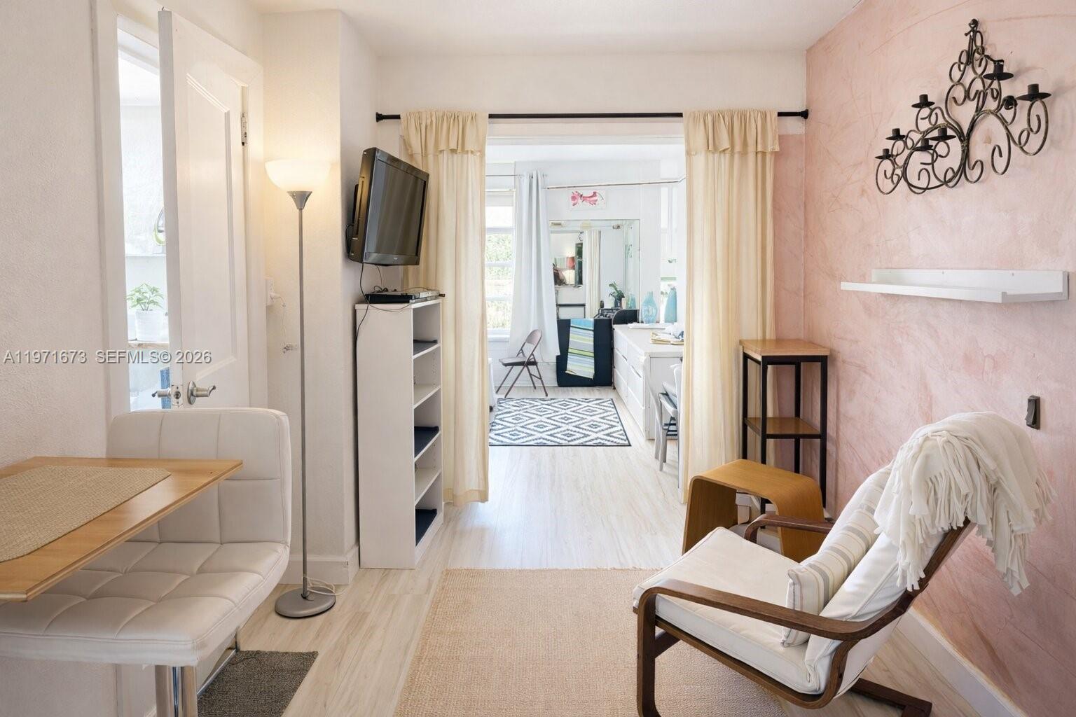 428 Southwest 9th Street, Unit 15 Miami, FL 33130 - Photo 2 of 13 a living room with furniture and a flat screen tv