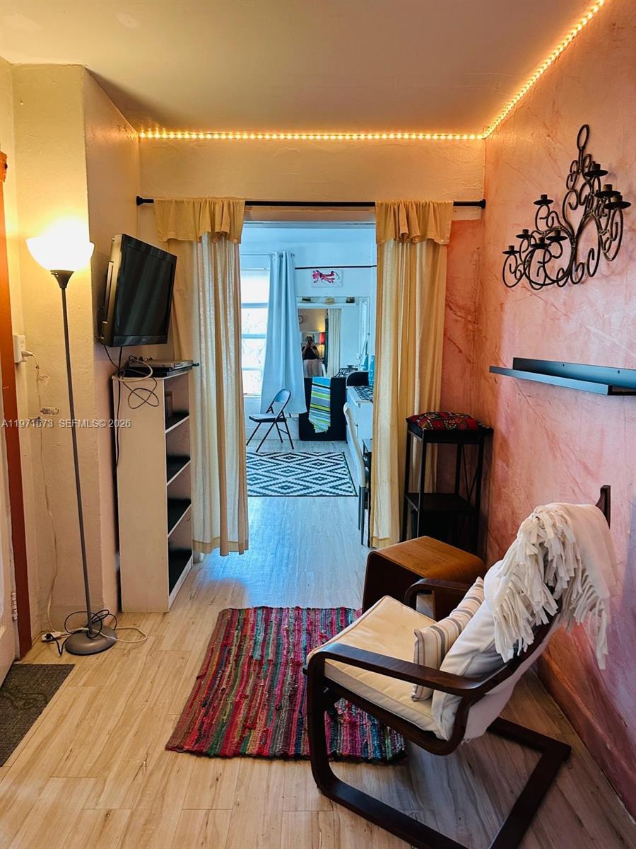 428 Southwest 9th Street, Unit 15 Miami, FL 33130 - Photo 3 of 13 a living room with furniture and a flat screen tv