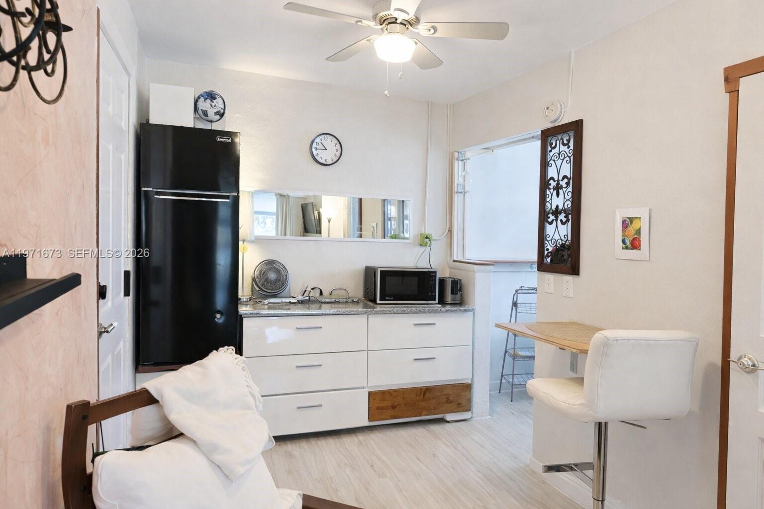 428 Southwest 9th Street, Unit 15 Miami, FL 33130 - Photo 6 of 13 a living room with furniture and a table