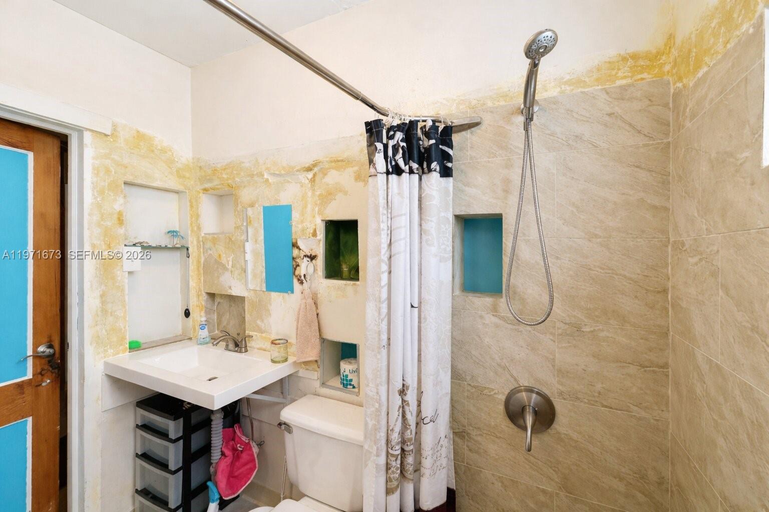 428 Southwest 9th Street, Unit 15 Miami, FL 33130 - Photo 8 of 13 a bathroom with a sink toilet and shower