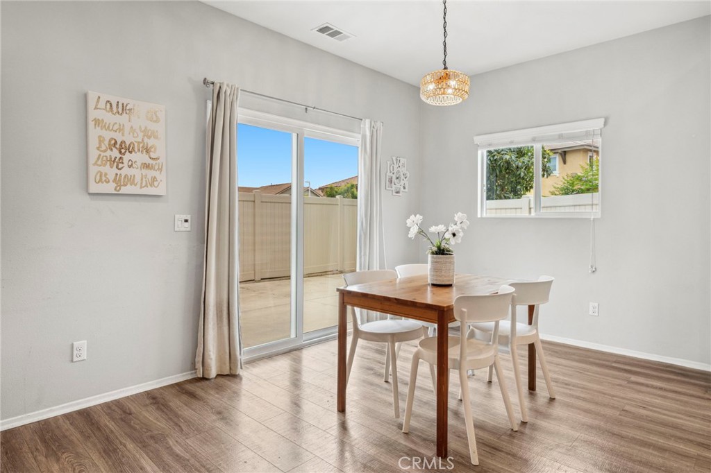 205 Spotted Saddle Way Fallbrook, CA 92028 - Photo 11 of 63 a dining room with furniture and window