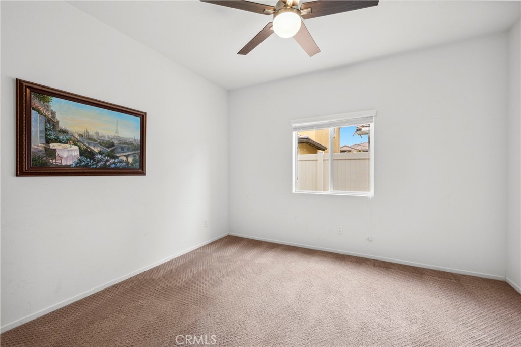205 Spotted Saddle Way Fallbrook, CA 92028 - Photo 18 of 63 a view of room with window and ceiling fan
