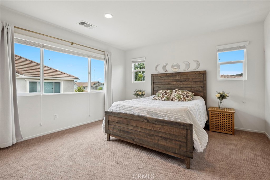 205 Spotted Saddle Way Fallbrook, CA 92028 - Photo 22 of 63 a bedroom with a bed and a cabinets