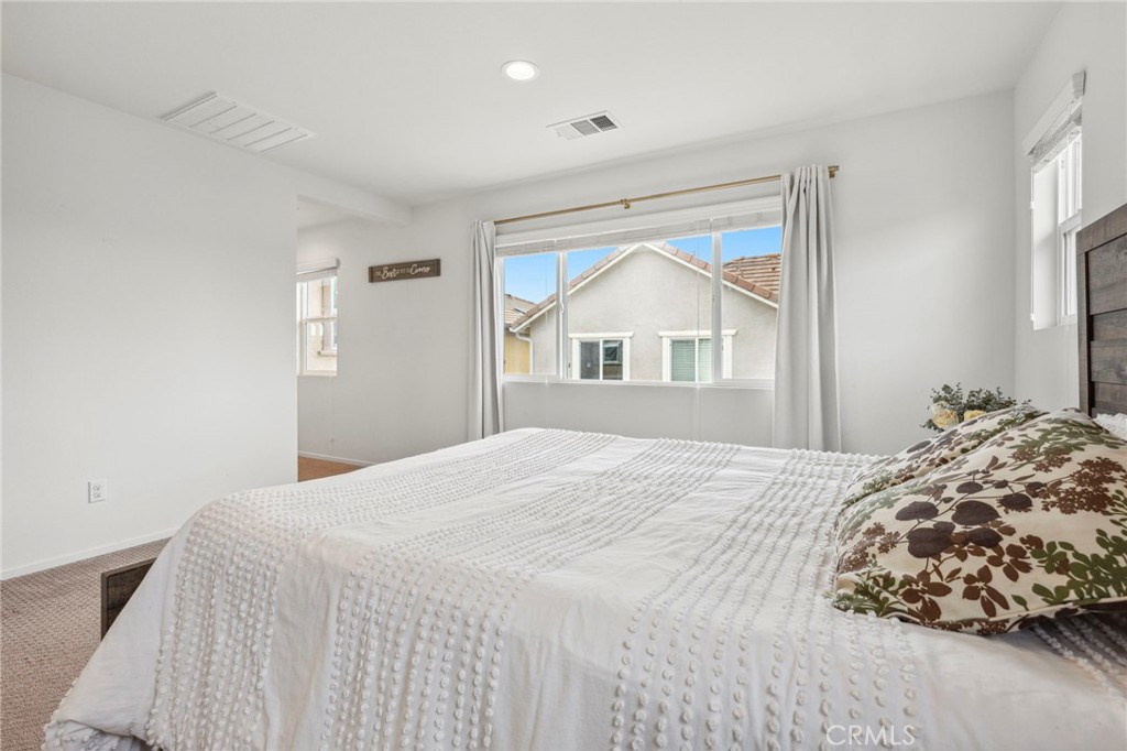205 Spotted Saddle Way Fallbrook, CA 92028 - Photo 24 of 63 a bedroom with a bed and a window