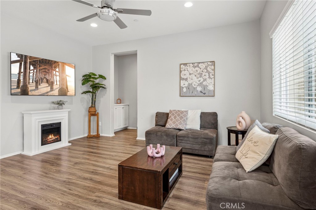 205 Spotted Saddle Way Fallbrook, CA 92028 - Photo 3 of 63 a living room with furniture and a fireplace
