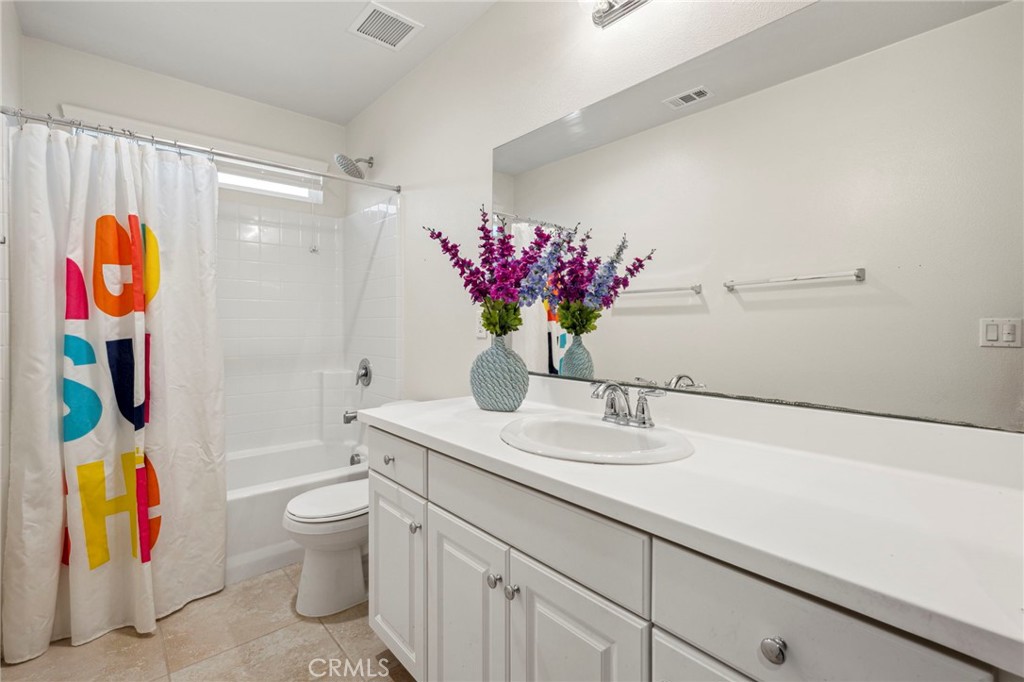 205 Spotted Saddle Way Fallbrook, CA 92028 - Photo 34 of 63 a bathroom with a sink vanity granite toilet tub and shower