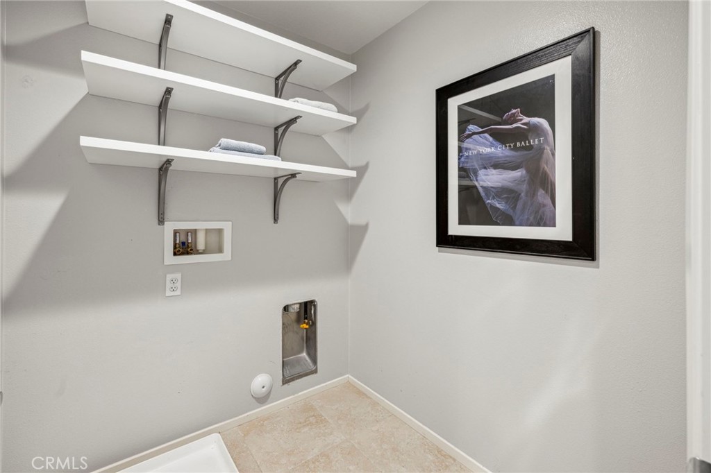 205 Spotted Saddle Way Fallbrook, CA 92028 - Photo 35 of 63 a view of a hallway with a book shelf