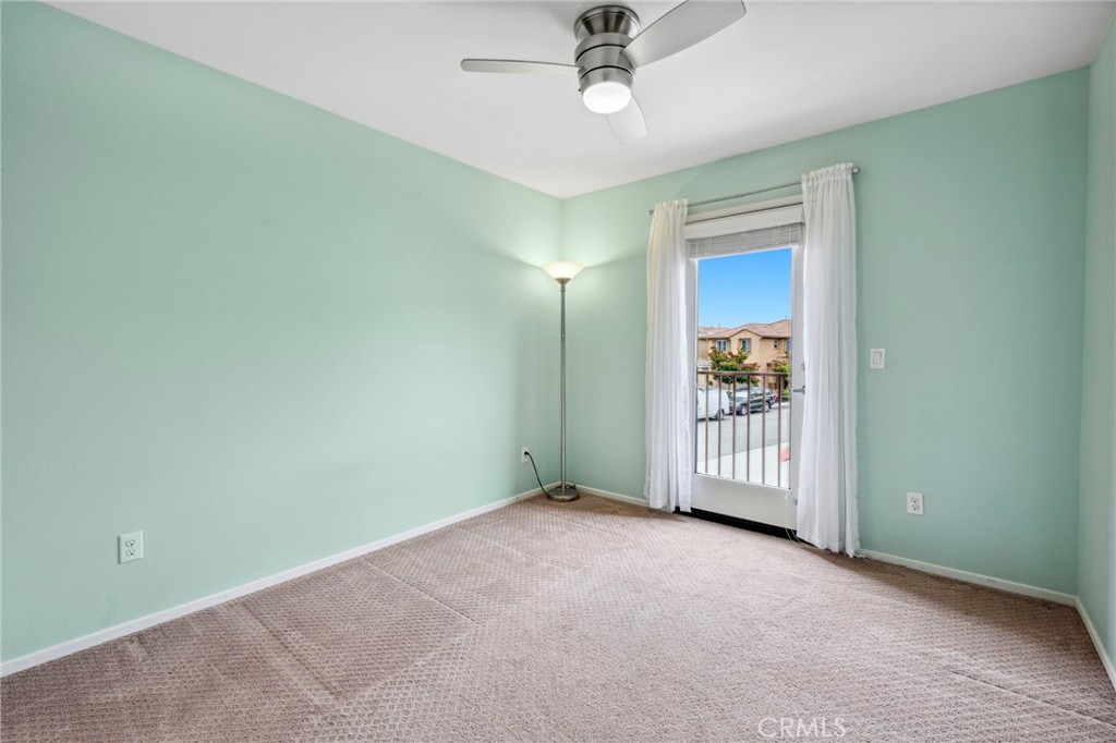 205 Spotted Saddle Way Fallbrook, CA 92028 - Photo 36 of 63 an empty room with a fan & a ceiling fan