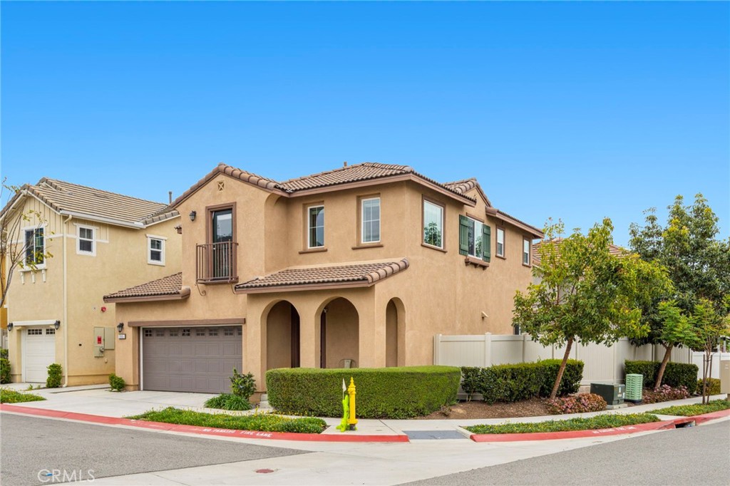 205 Spotted Saddle Way Fallbrook, CA 92028 - Photo 39 of 63 a front view of a house with a yard and garage