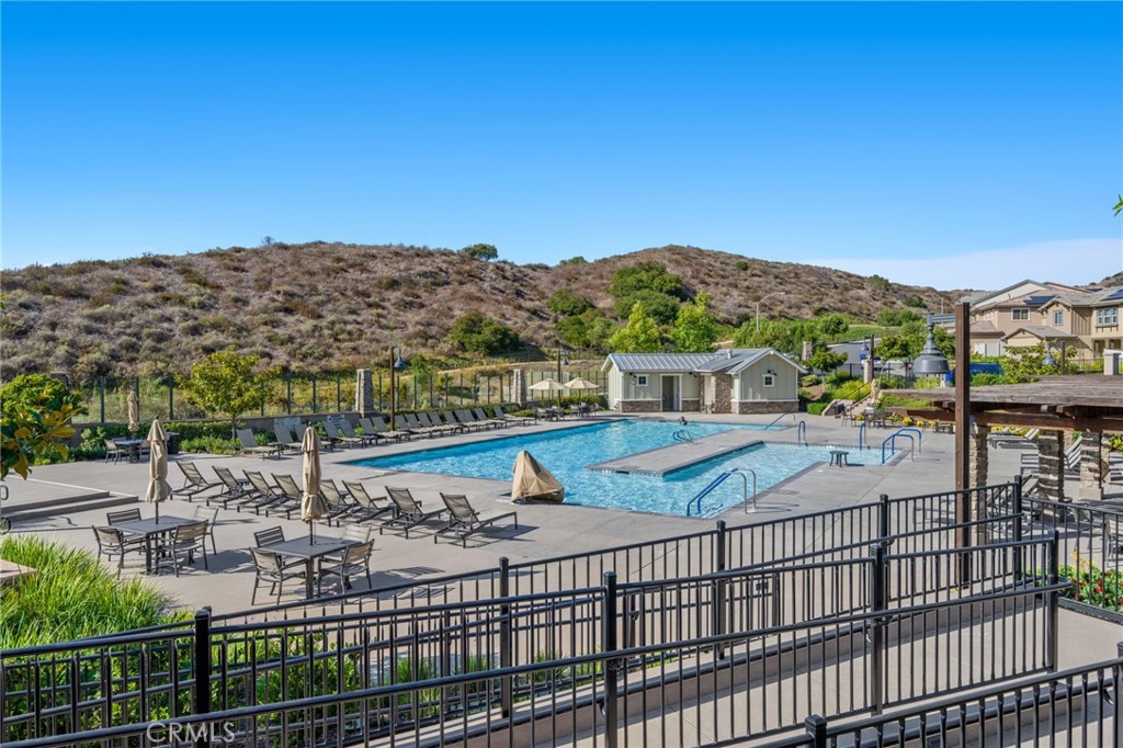 205 Spotted Saddle Way Fallbrook, CA 92028 - Photo 47 of 63 a view of a terrace with a table and chairs