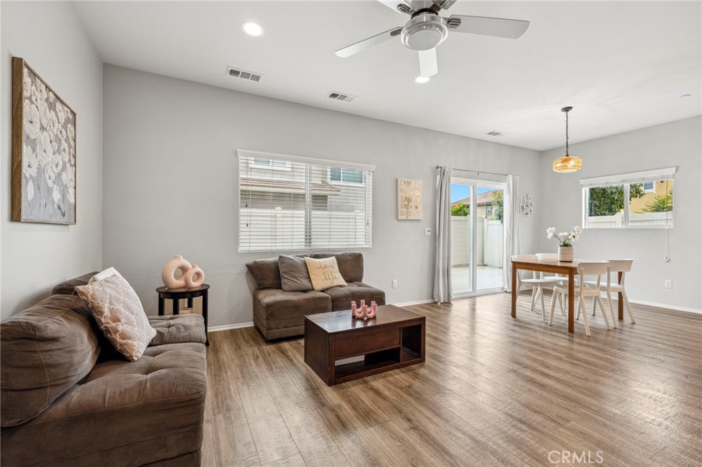 205 Spotted Saddle Way Fallbrook, CA 92028 - Photo 10 of 63 a living room with furniture and a wooden floor