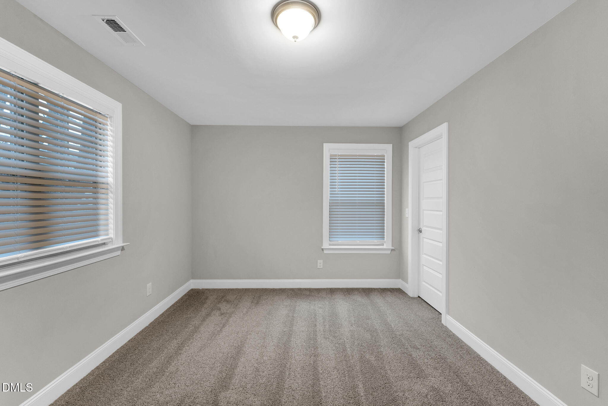 928 Barringer Drive Raleigh, NC 27606 - Photo 18 of 40 an empty room with a window