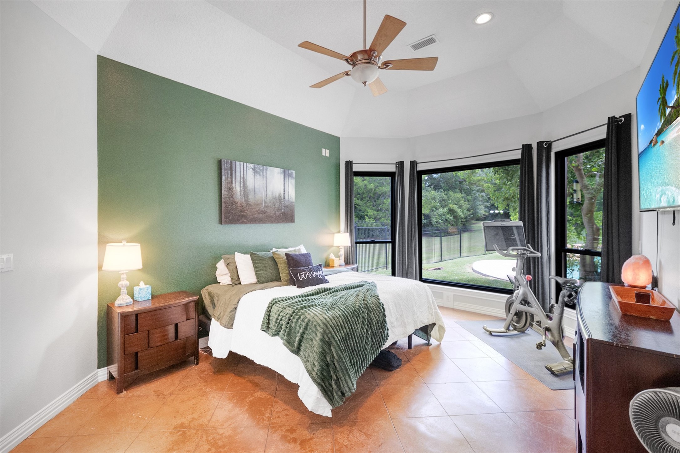 20019 Peel Road Montgomery, TX 77356 - Photo 21 of 46 The primary enjoys large windows and a great view of the pool.