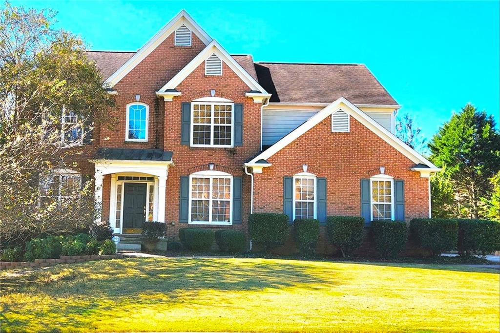 a front view of a house with swimming pool