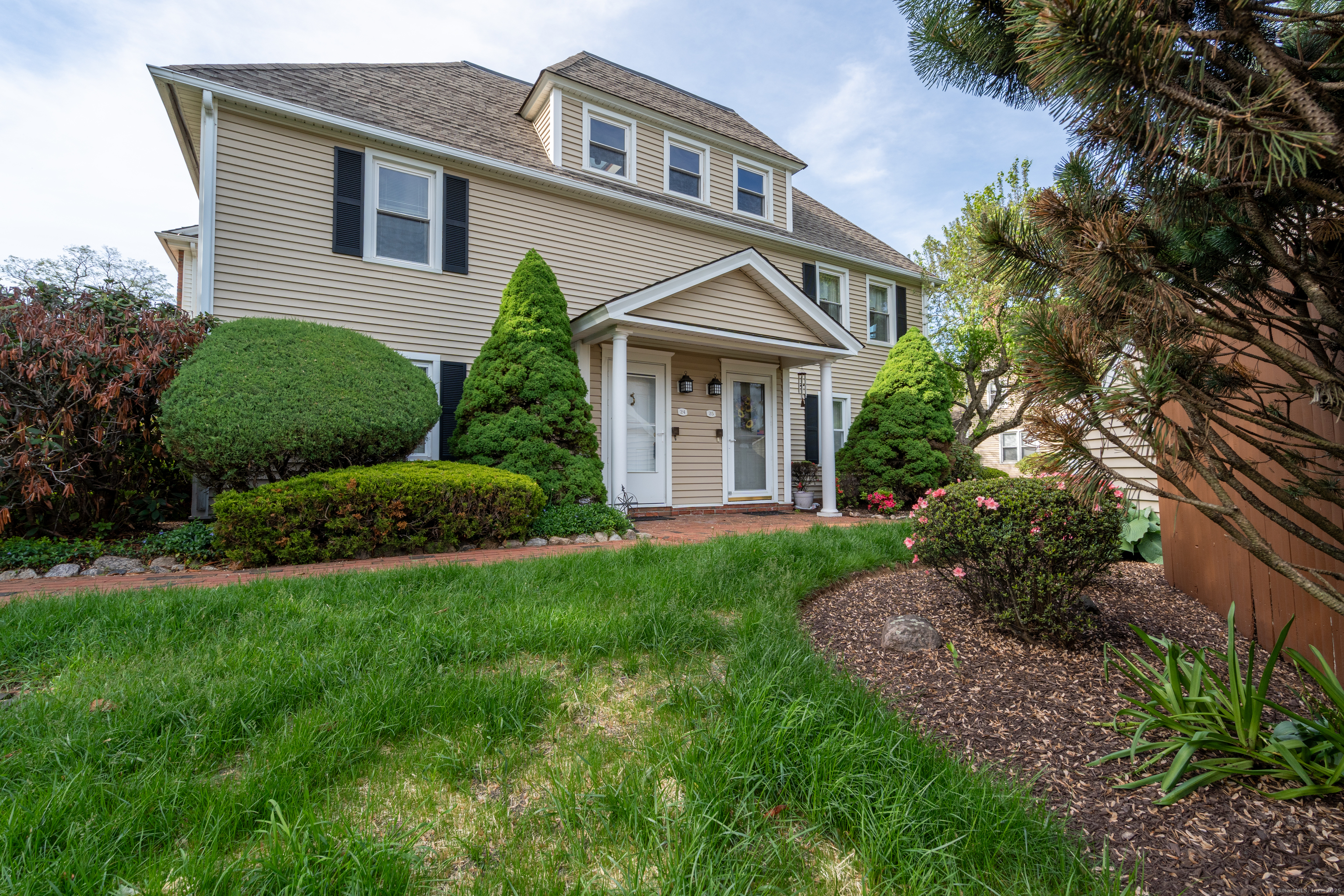 a front view of a house with a yard