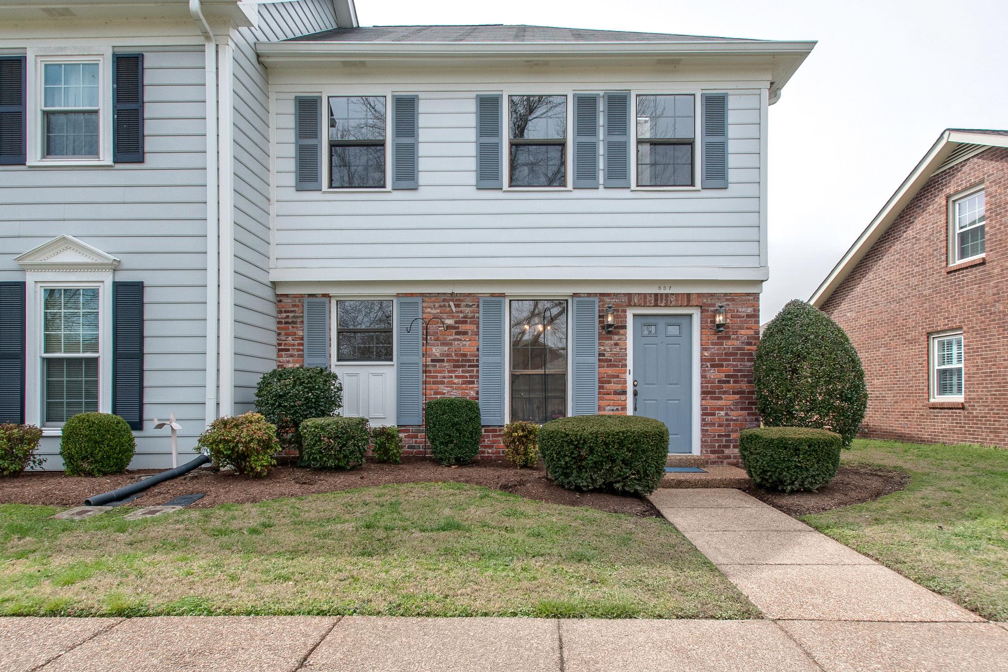 537 General George Patton Road Nashville, TN 37221 - Photo 1 of 29 a front view of a house with garden