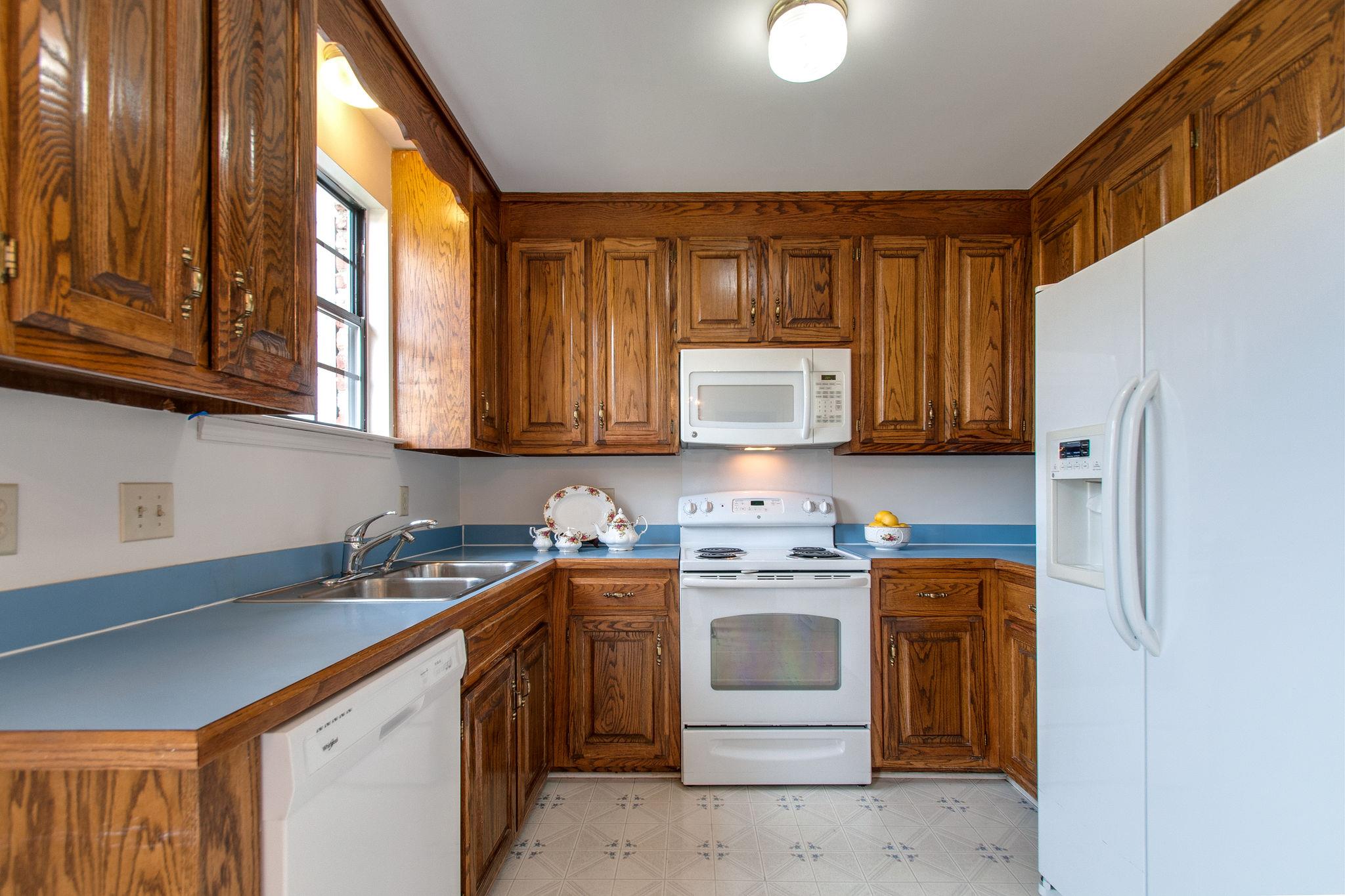 537 General George Patton Road Nashville, TN 37221 - Photo 14 of 29 a kitchen with stainless steel appliances granite countertop a sink stove and refrigerator