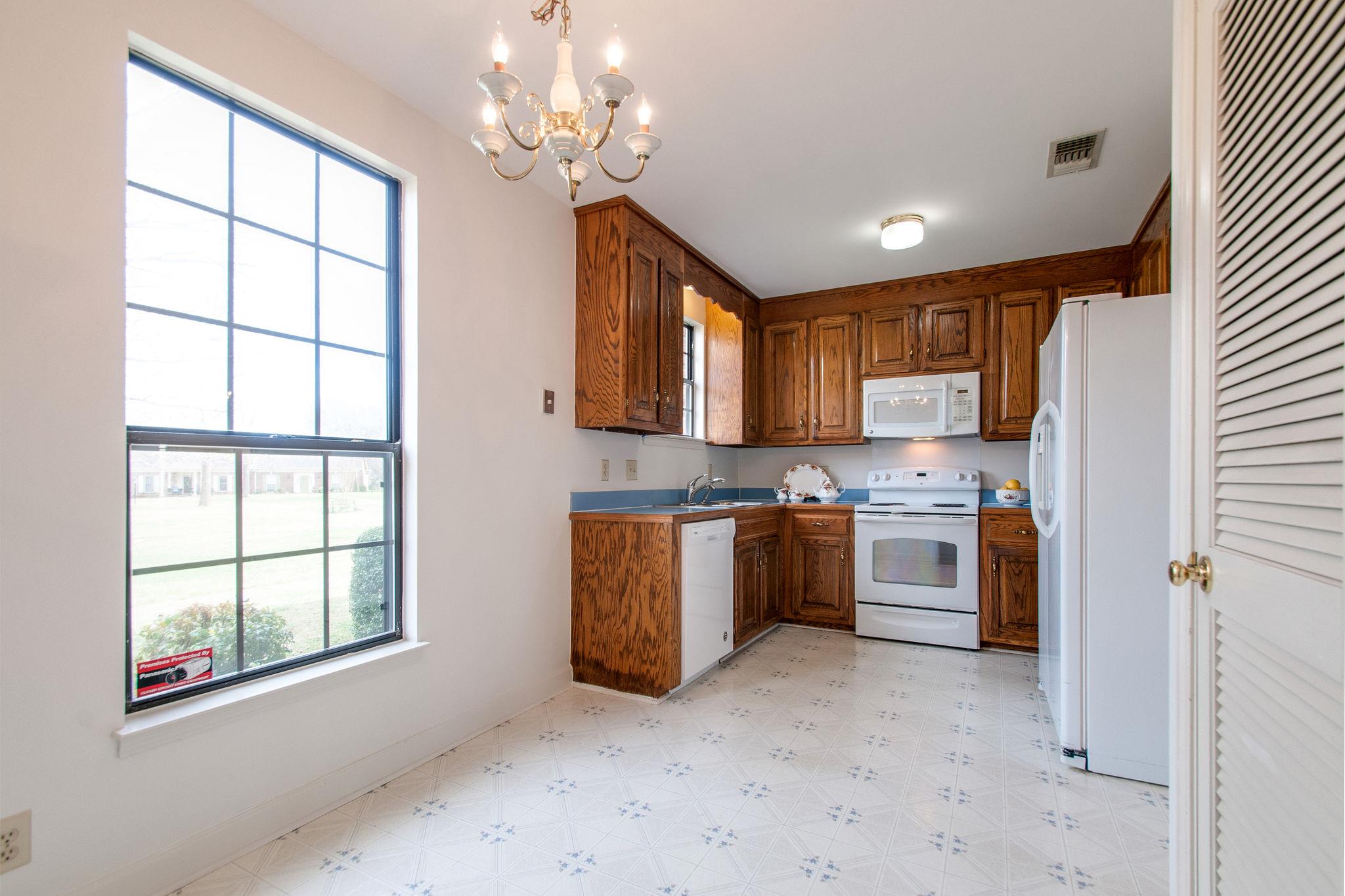 537 General George Patton Road Nashville, TN 37221 - Photo 15 of 29 a large kitchen with stainless steel appliances granite countertop a stove sink and cabinets