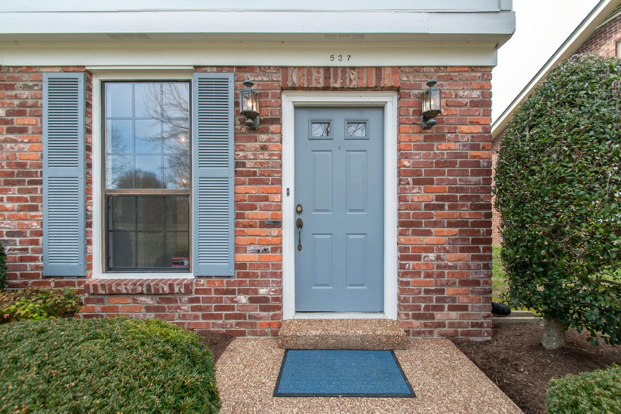 537 General George Patton Road Nashville, TN 37221 - Photo 3 of 29 a front view of a house with a garden
