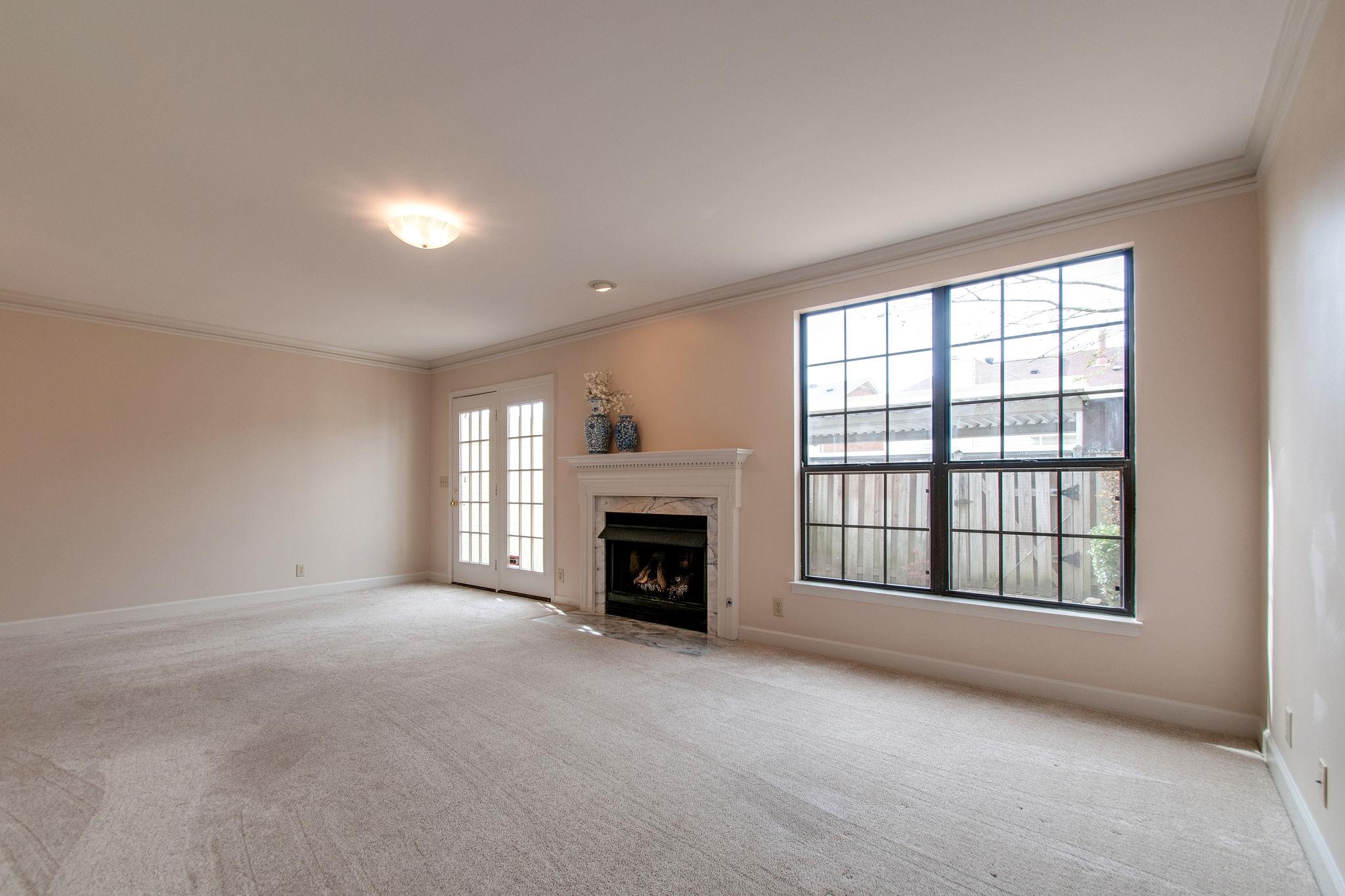 537 General George Patton Road Nashville, TN 37221 - Photo 8 of 29 a view of an empty room with a fireplace and a window