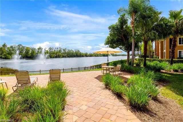 a buildings with car parked in front of it