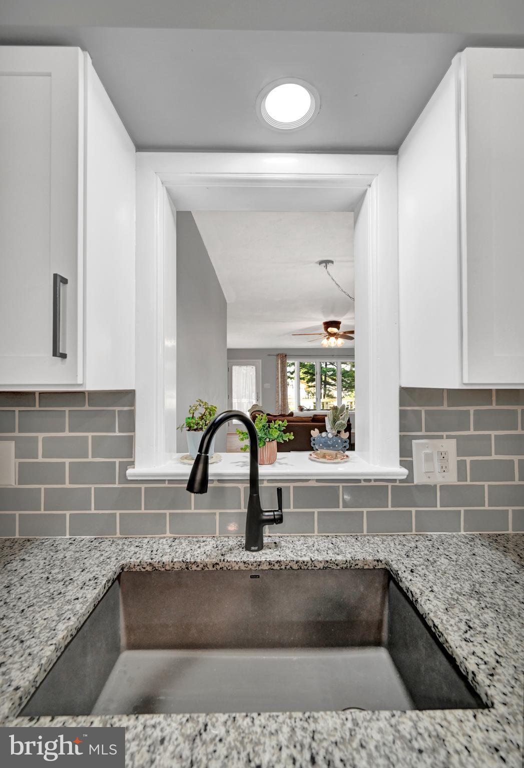 2340 Redwood Road York, PA 17408 - Photo 17 of 68 a kitchen with granite countertop a sink and a stove
