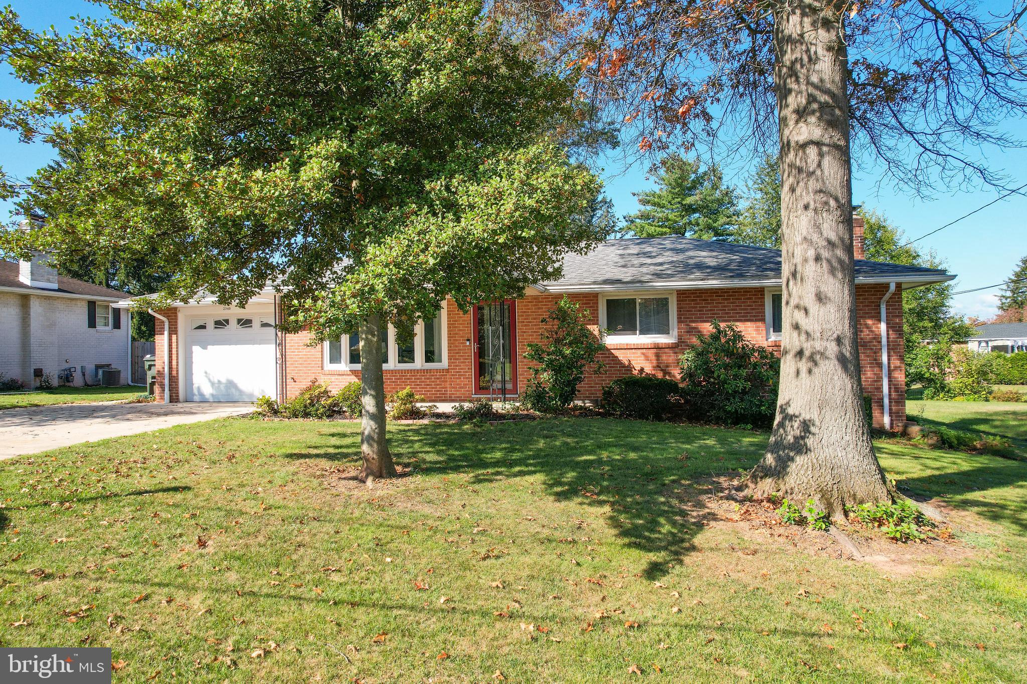 2340 Redwood Road York, PA 17408 - Photo 3 of 68 a house with trees in front of it