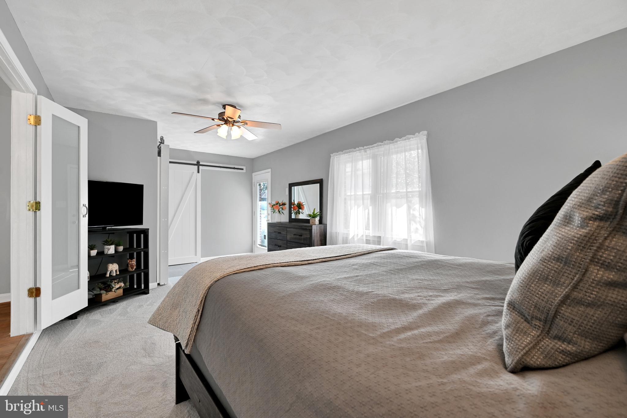 2340 Redwood Road York, PA 17408 - Photo 34 of 68 a spacious bedroom with a bed and a television