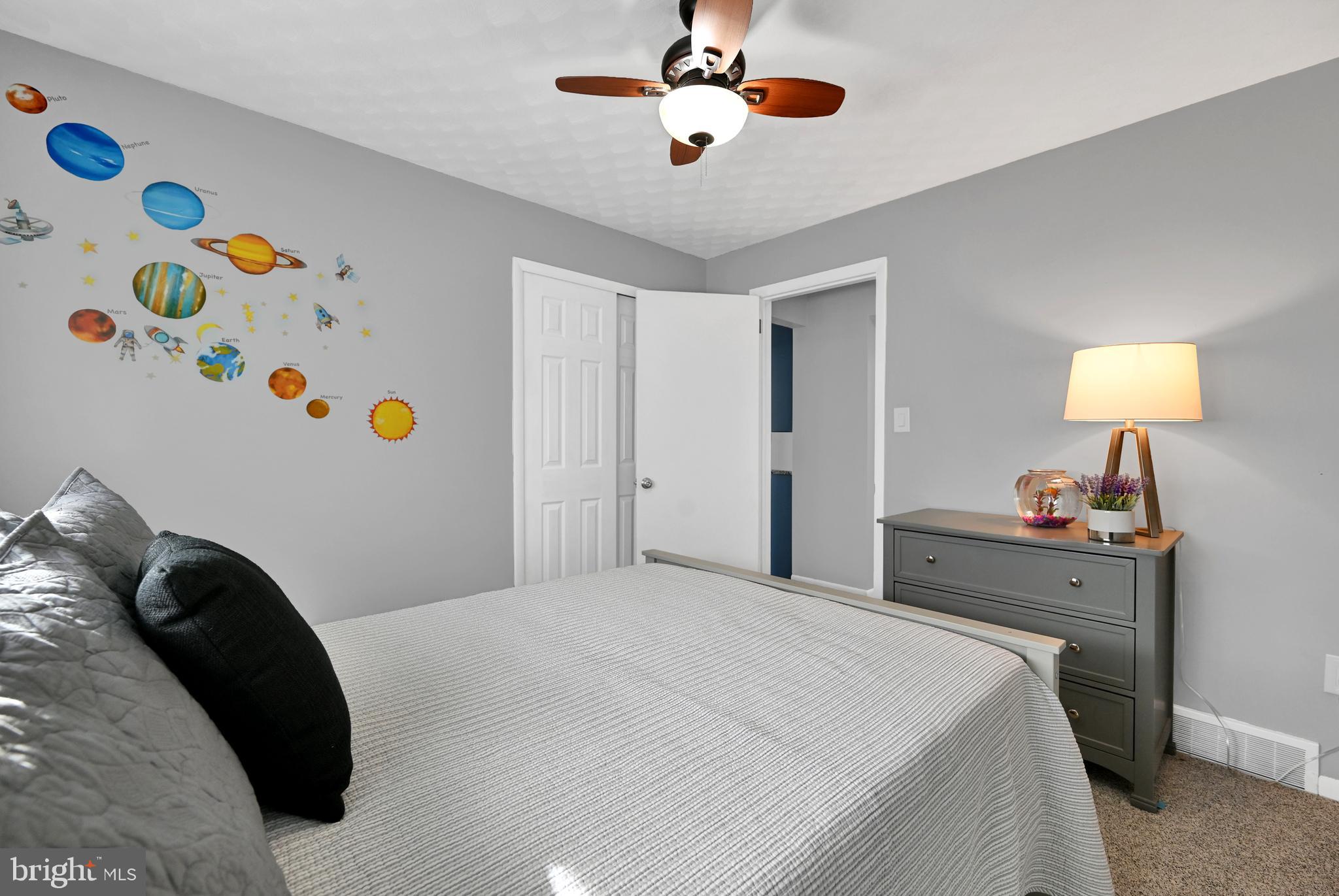 2340 Redwood Road York, PA 17408 - Photo 44 of 68 a bedroom with a bed and a chandelier