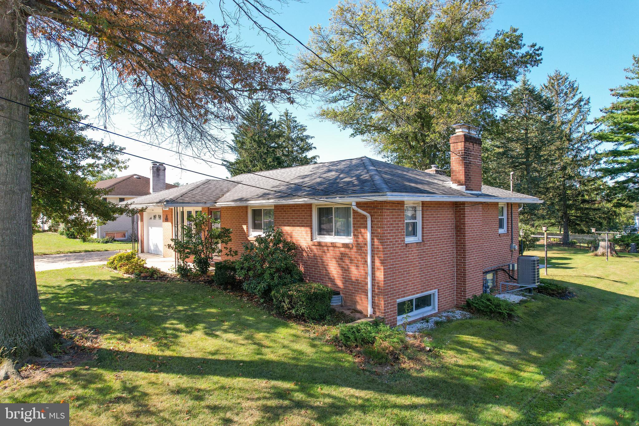 2340 Redwood Road York, PA 17408 - Photo 5 of 68 a front view of a house with garden
