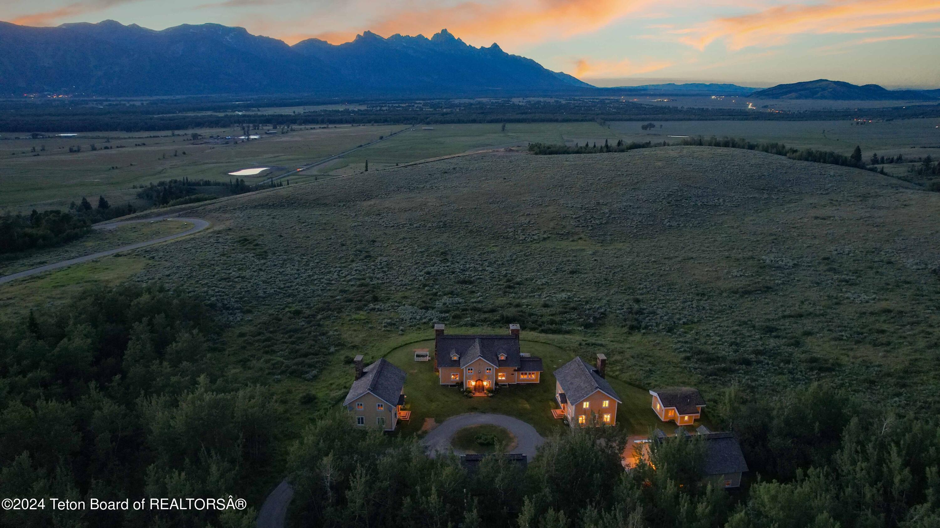 255 East Lucas Riva Ridge Road Jackson, WY 83001 - Photo 2 of 38 Evening Aerial of Property