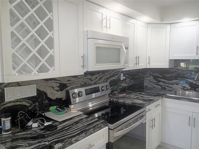 a living room filled with furniture and flowers