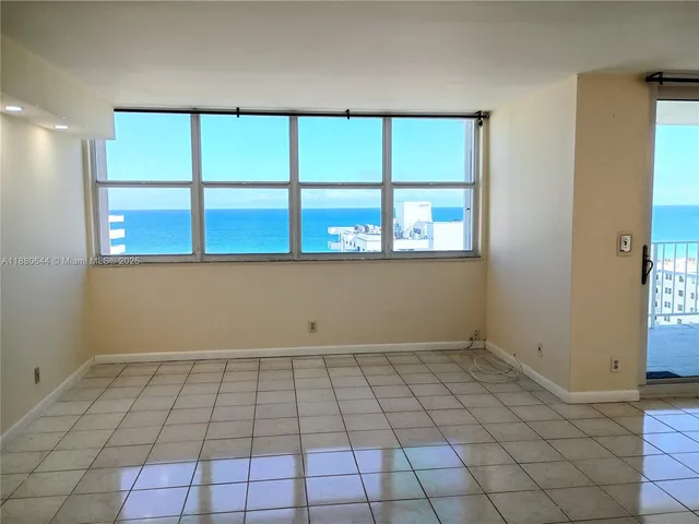 a view of an empty room with a window