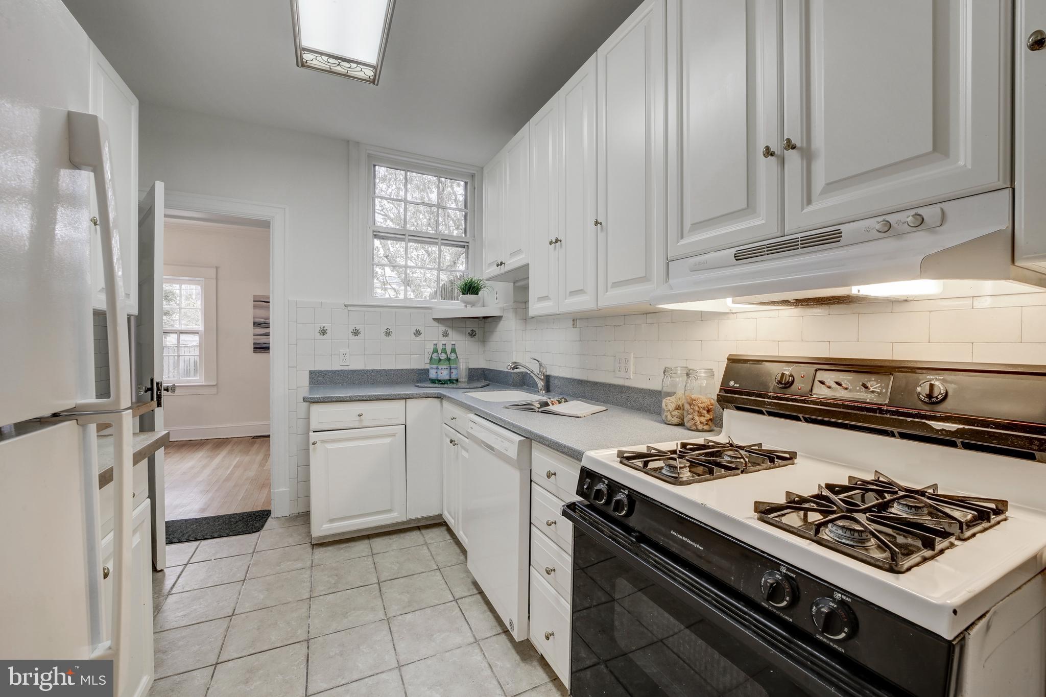 2849 29th Street Northwest Washington, DC 20008 - Photo 18 of 38 a kitchen with cabinets and appliances