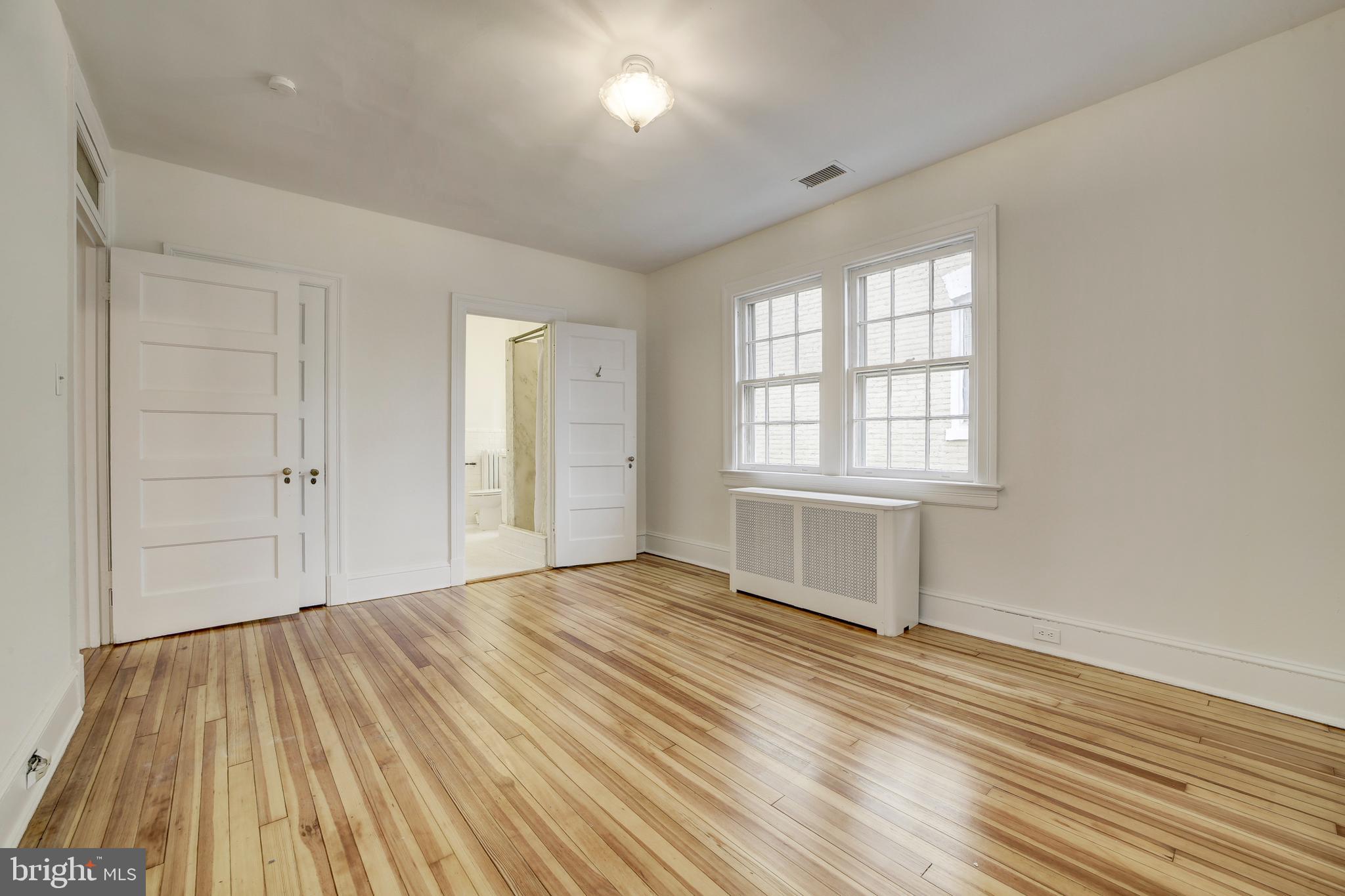2849 29th Street Northwest Washington, DC 20008 - Photo 26 of 38 a view of empty room with wooden floor and fan