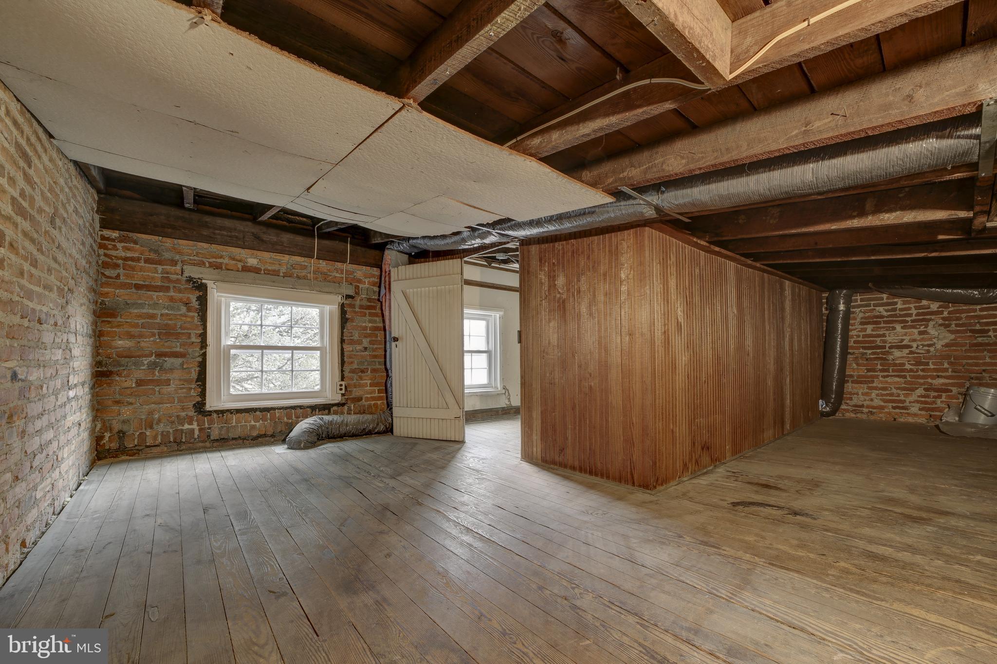 2849 29th Street Northwest Washington, DC 20008 - Photo 33 of 38 an empty room with wooden floor and windows