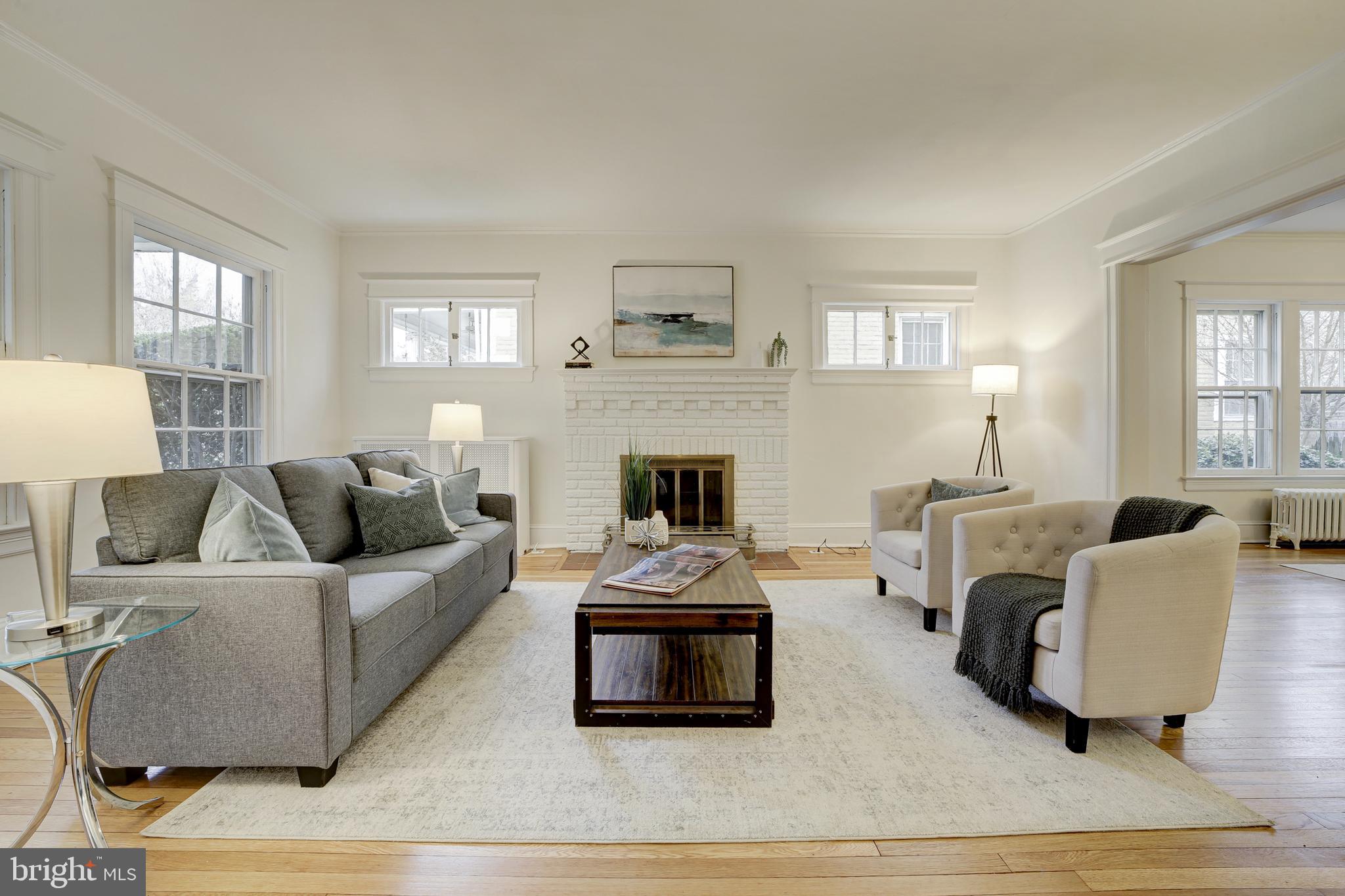 2849 29th Street Northwest Washington, DC 20008 - Photo 6 of 38 a living room with furniture and a fireplace