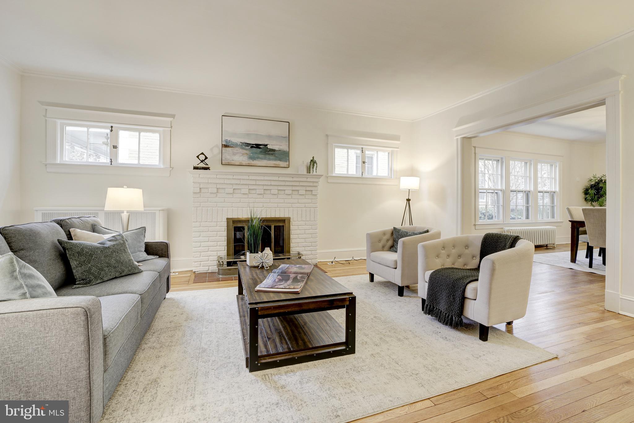 2849 29th Street Northwest Washington, DC 20008 - Photo 7 of 38 a living room with furniture and a fireplace