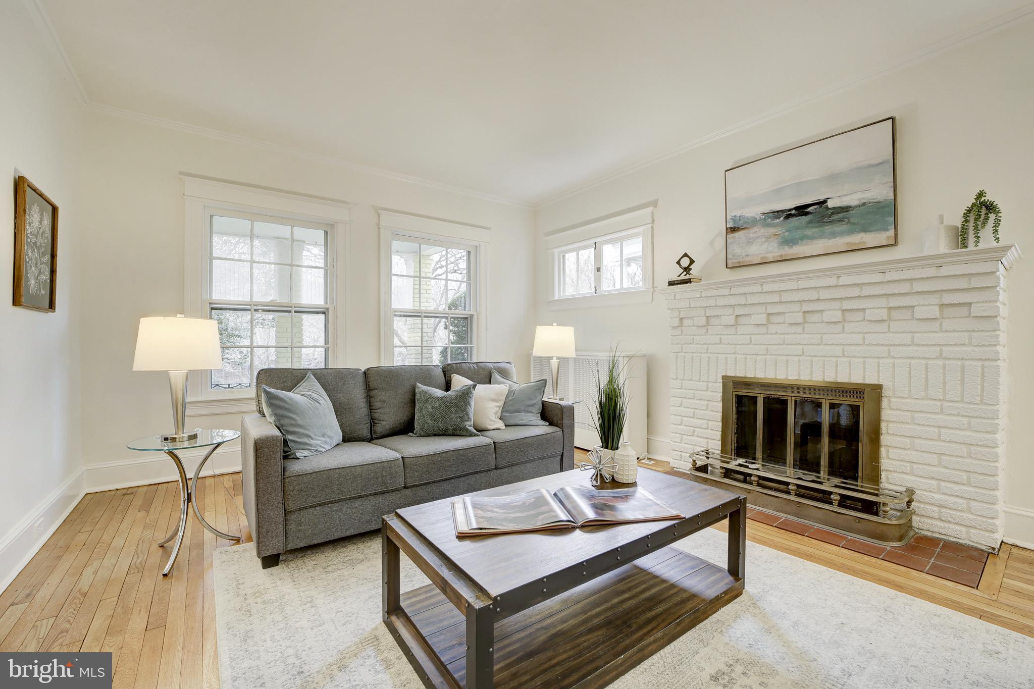 2849 29th Street Northwest Washington, DC 20008 - Photo 8 of 38 a living room with furniture a fireplace and window
